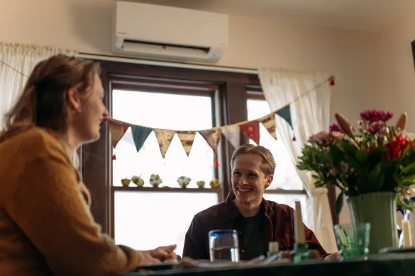 Mini-split in dining room with happy couple