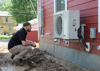 Contractor looking at heat pump install